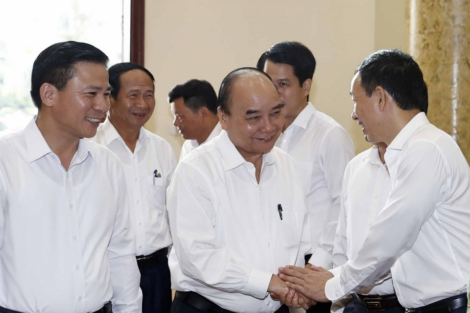 Chủ tịch nước Nguyễn Xuân Phúc cùng các đại biểu dự buổi làm việc. (Ảnh: Thống Nhất/TTXVN)