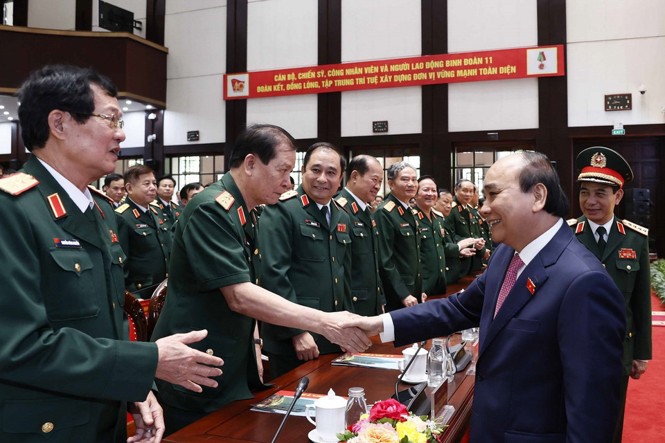 Chủ tịch nước Nguyễn Xuân Phúc với các đại biểu tham dự buổi lễ. (Ảnh: Thống Nhất/TTXVN)