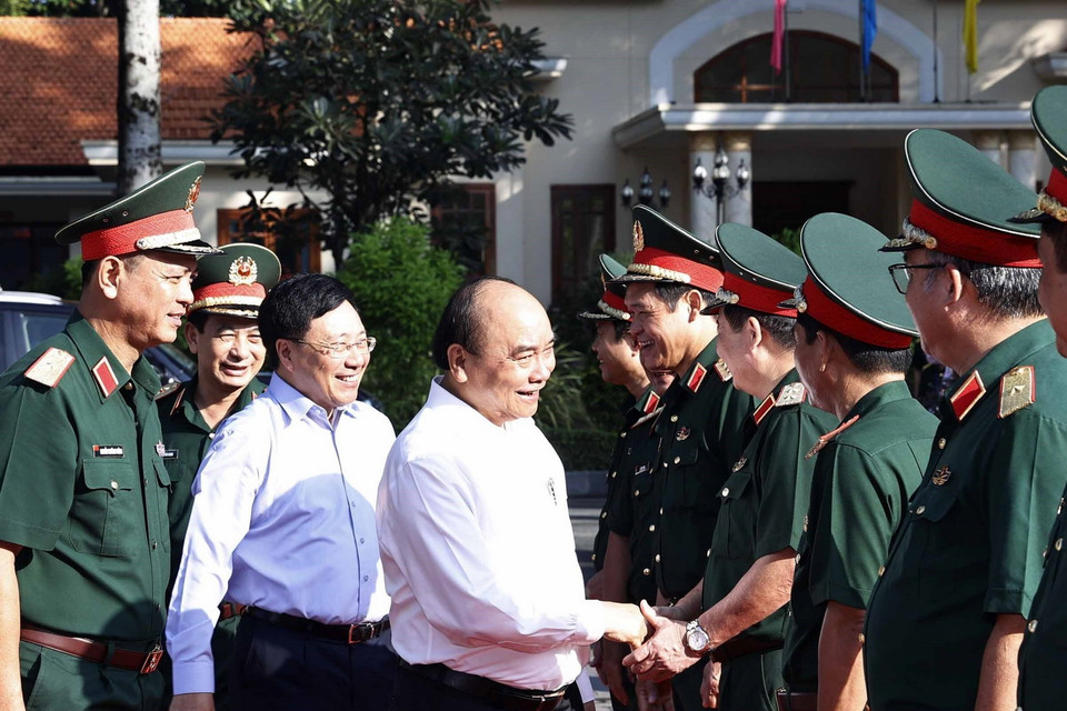 Chủ tịch nước Nguyễn Xuân Phúc với các đại biểu tham dự hội thảo. (Ảnh: Thống Nhất/TTXVN)