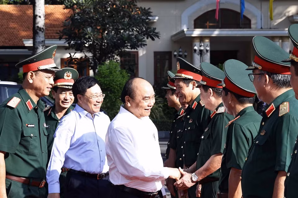 Chủ tịch nước Nguyễn Xuân Phúc với các đại biểu tham dự hội thảo. (Ảnh: Thống Nhất/TTXVN)