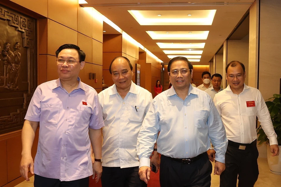 Chủ tịch nước Nguyễn Xuân Phúc, Thủ tướng Phạm Minh Chính, Chủ tịch Quốc hội Vương Đình Huệ đến dự hội nghị. (Ảnh: Trí Dũng/TTXVN)