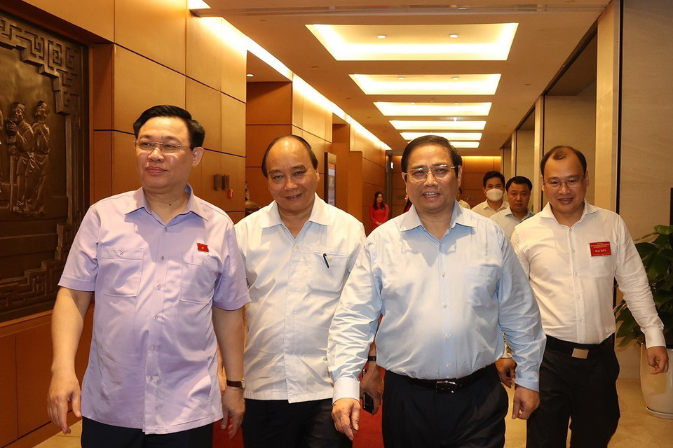 Chủ tịch nước Nguyễn Xuân Phúc, Thủ tướng Phạm Minh Chính, Chủ tịch Quốc hội Vương Đình Huệ đến dự hội nghị. (Ảnh: Trí Dũng/TTXVN)