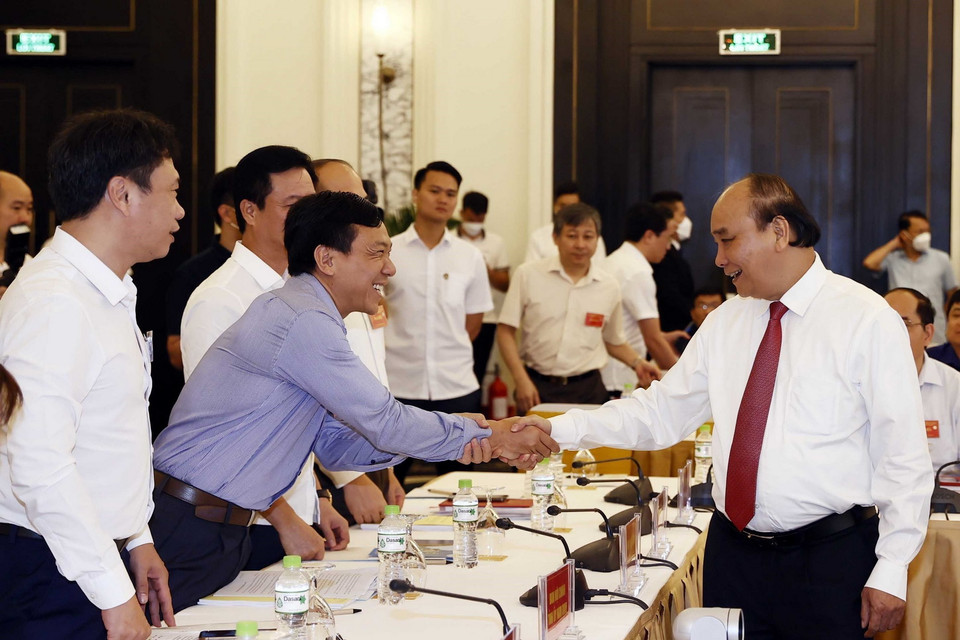 Chủ tịch nước Nguyễn Xuân Phúc và các đại biểu tại hội nghị. (Ảnh: Thống Nhất/TTXVN)