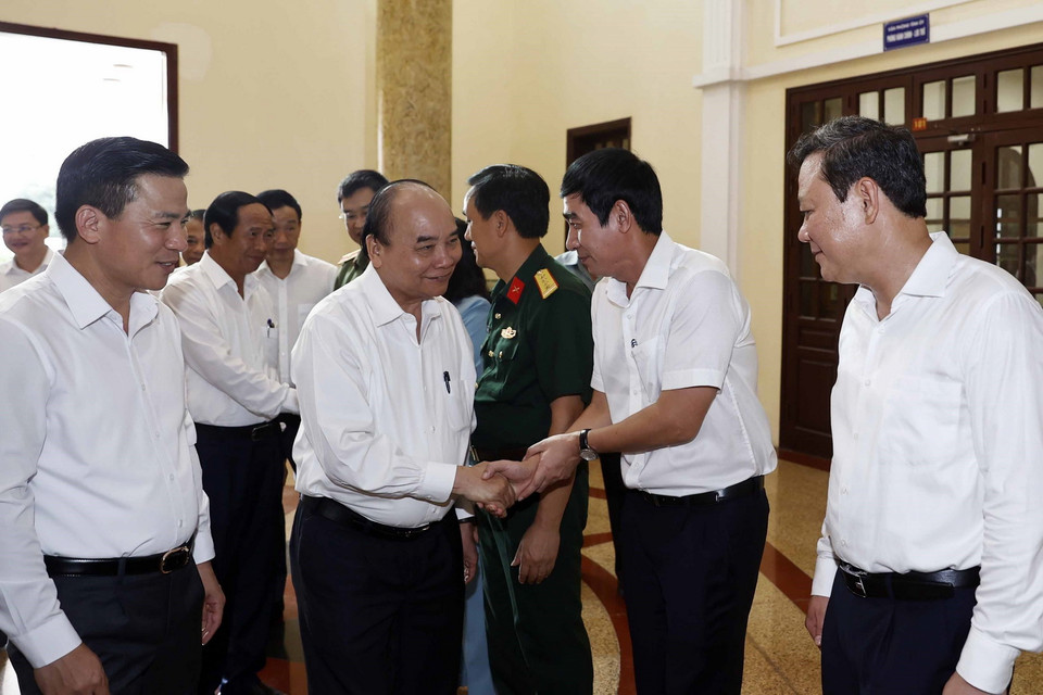 Chủ tịch nước Nguyễn Xuân Phúc với các đại biểu dự buổi làm việc. (Ảnh: Thống Nhất/TTXVN)