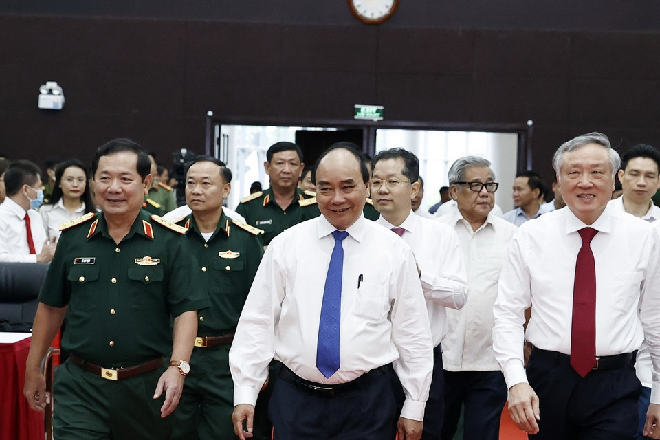 Chủ tịch nước Nguyễn Xuân Phúc và các đại biểu đến dự Hội thảo. (Ảnh: Thống Nhất/TTXVN)