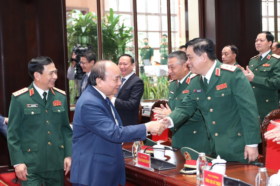 Chủ tịch nước Nguyễn Xuân Phúc với các đại biểu dự buổi lễ. (Ảnh: Trọng Đức/TTXVN)