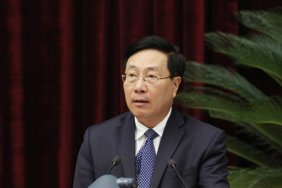 Ông Phạm Bình Minh, Ủy viên Bộ Chính trị, Phó Thủ tướng Thường trực Chính phủ trình bày báo cáo tại hội nghị. (Ảnh: Phương Hoa/TTXVN)