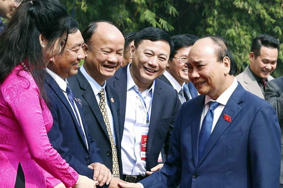 Chủ tịch nước Nguyễn Xuân Phúc với các đại biểu. (Ảnh: Thống Nhất/TTXVN)