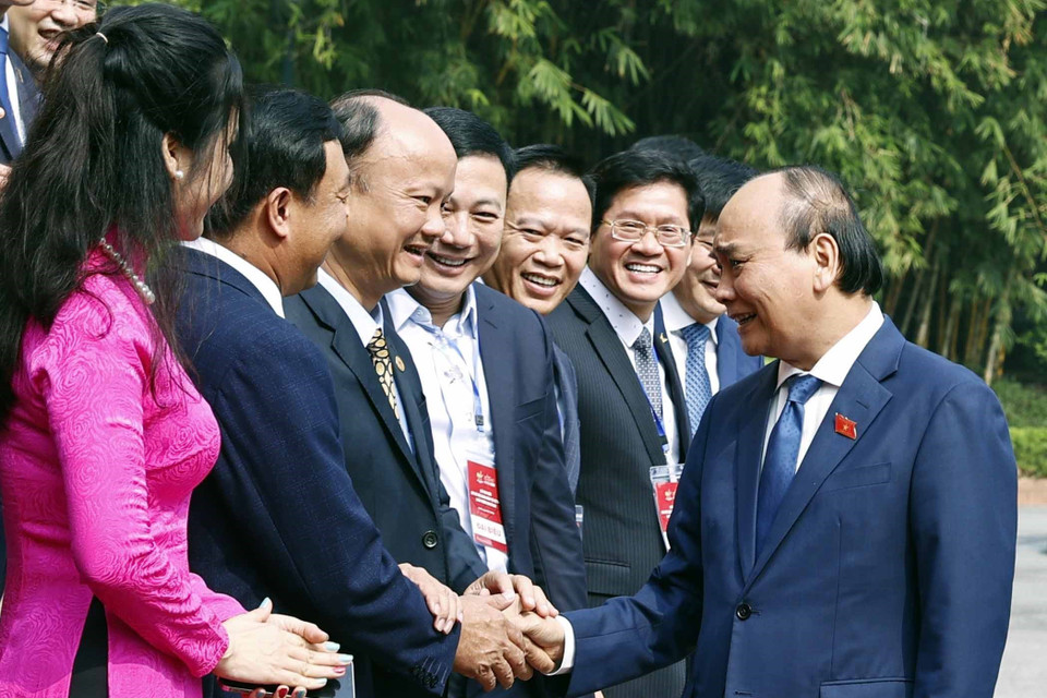 Chủ tịch nước Nguyễn Xuân Phúc với các đại biểu. (Ảnh: Thống Nhất/TTXVN)