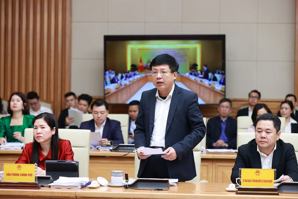 Phó Chủ tịch Ủy ban Quản lý vốn Nhà nước tại doanh nghiệp Hồ Sỹ Hùng báo cáo giải pháp đổi mới hoạt động của Ủy ban. (Ảnh: Dương Giang/TTXVN)