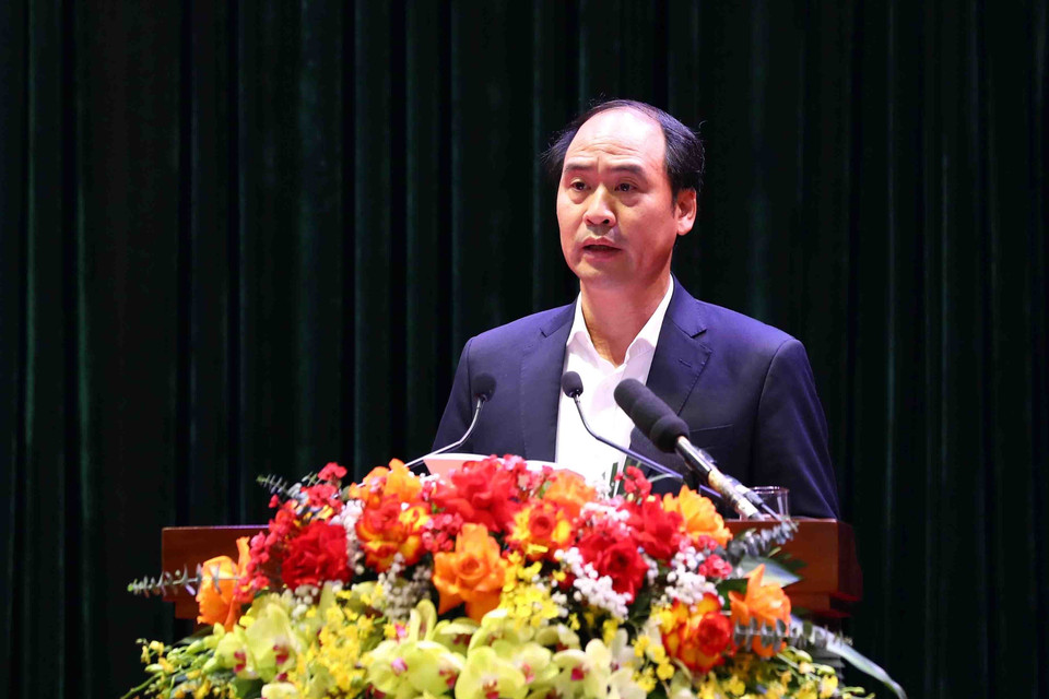 Thứ trưởng Bộ Lao động, Thương binh và Xã hội Nguyễn Văn Hồi trình bày tham luận. (Ảnh: Phạm Kiên/TTXVN)