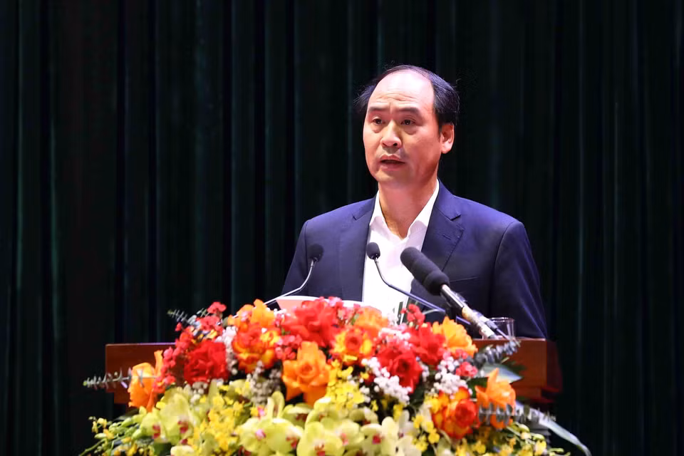 Thứ trưởng Bộ Lao động, Thương binh và Xã hội Nguyễn Văn Hồi trình bày tham luận. (Ảnh: Phạm Kiên/TTXVN)