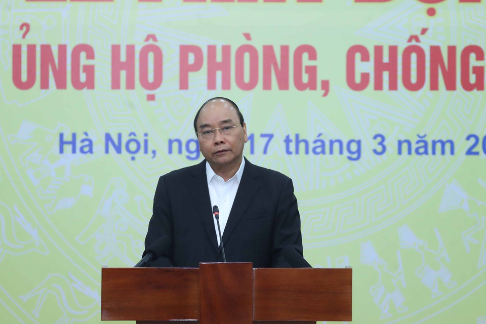 Thủ tướng Nguyễn Xuân Phúc phát biểu tại Lễ phát động toàn dân ủng hộ phòng, chống dịch COVID-19. (Ảnh: Thống Nhất/TTXVN)