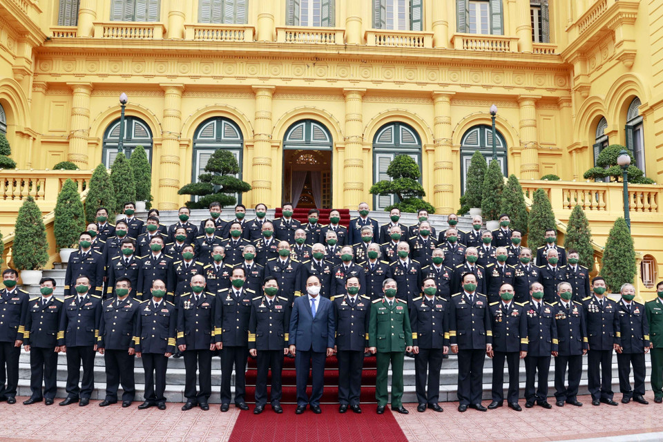 Chủ tịch nước Nguyễn Xuân Phúc với các đại biểu tại buổi gặp mặt. (Ảnh: Thống Nhất/TTXVN)