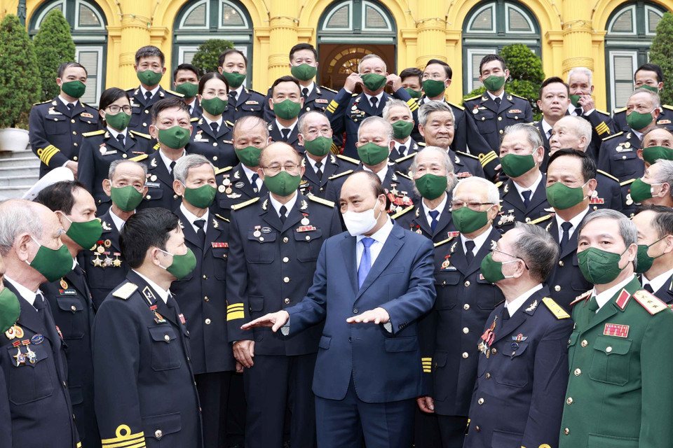 Chủ tịch nước Nguyễn Xuân Phúc với các đại biểu tại buổi gặp mặt. (Ảnh: Thống Nhất/TTXVN)