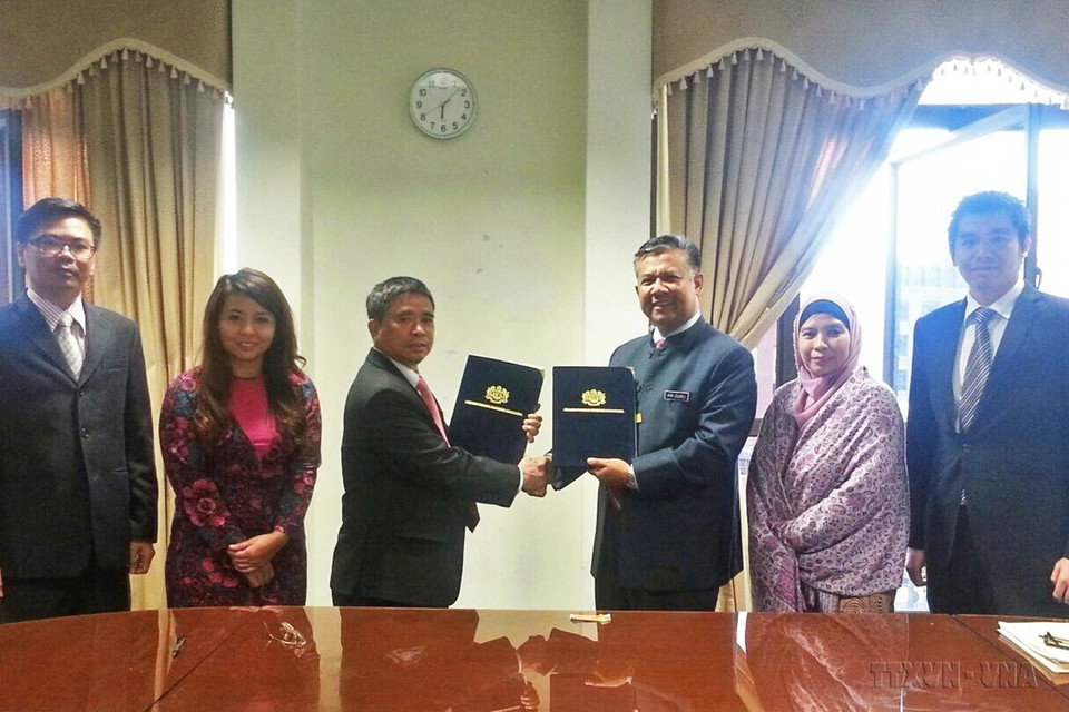 Phiên đàm phán thứ 3 Bản ghi nhớ Việt Nam-Malaysia về việc làm của người lao động Việt Nam tại Malaysia và Bản ghi nhớ giữa hai Chính phủ về việc tuyển dụng và bố trí lao động giúp việc gia đình Việt Nam tại Malaysia, ngày 19/5/2015. (Ảnh: Kim Dung/TTXVN)