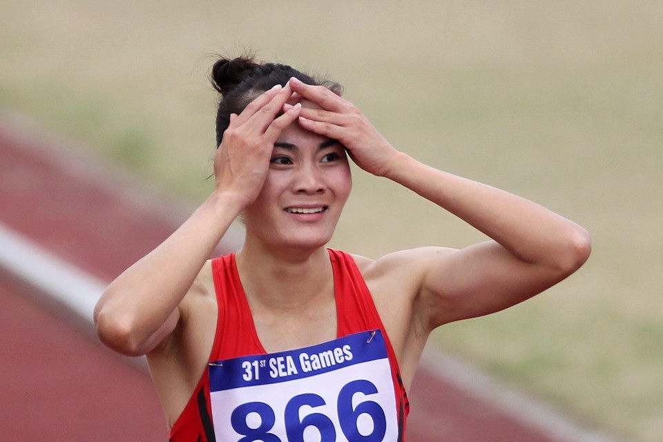 Quách Thị Lan bất ngờ với thành tich mình đạt được trên đường chạy chung kết. (Ảnh: Quốc Khánh/TTXVN)