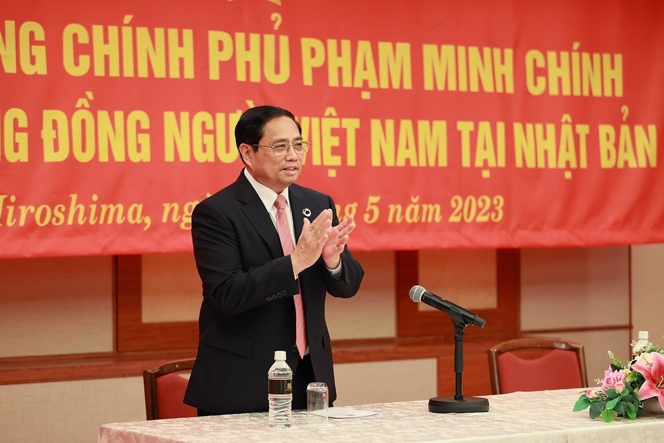 Thủ tướng Phạm Minh Chính gặp cộng đồng người Việt Nam tại Nhật Bản. (Ảnh: Dương Giang/TTXVN)