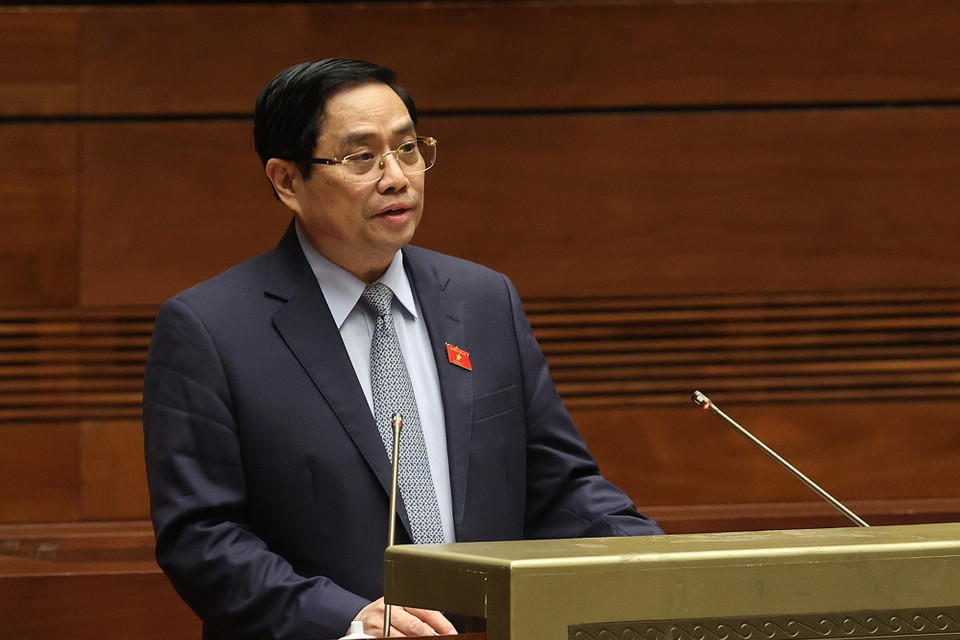 Thủ tướng Chính phủ nhiệm kỳ 2016-2021 Phạm Minh Chính trình bày Báo cáo giải trình, tiếp thu ý kiến của đại biểu Quốc hội về cơ cấu tổ chức của Chính phủ nhiệm kỳ 2021-2026. (Ảnh: Dương Giang/TTXVN)