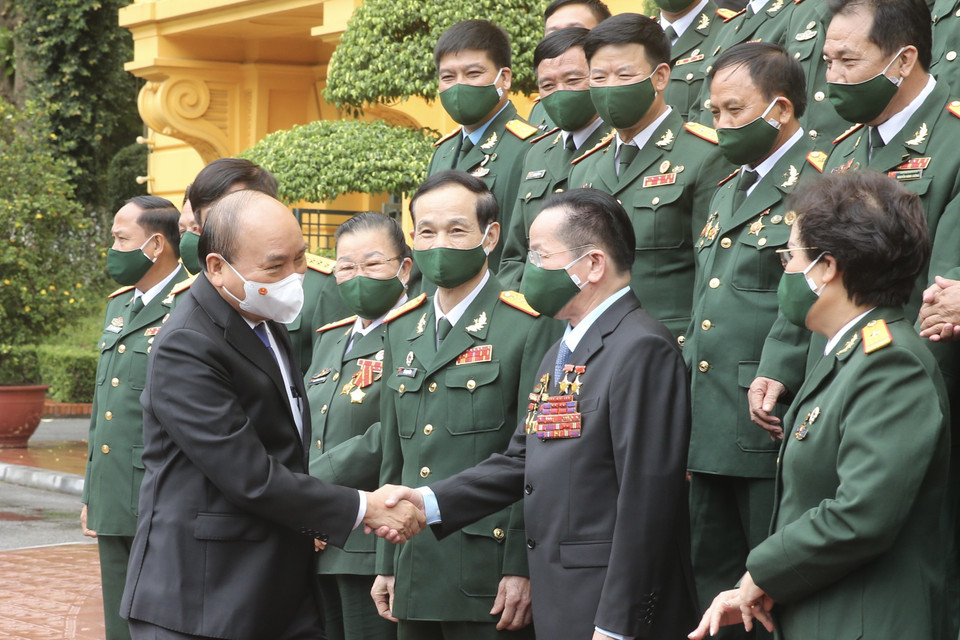 Chủ tịch nước Nguyễn Xuân Phúc gặp mặt đoàn đại biểu doanh nhân là các cựu chiến binh Việt Nam. (Ảnh: Lâm Khánh/TTXVN)