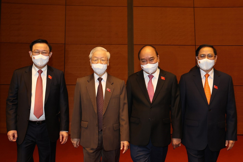 Tổng Bí thư Nguyễn Phú Trọng, Chủ tịch nước Nguyễn Xuân Phúc, Thủ tướng Chính phủ Phạm Minh Chính, Chủ tịch Quốc hội Vương Đình Huệ dự bế mạc Kỳ họp thứ hai, Quốc hội khóa XV. (Ảnh: Trí Dũng/TTXVN)