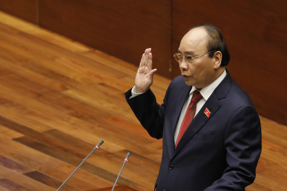 Chủ tịch nước Nguyễn Xuân Phúc tuyên thệ nhậm chức. (Ảnh: Văn Điệp/TTXVN)