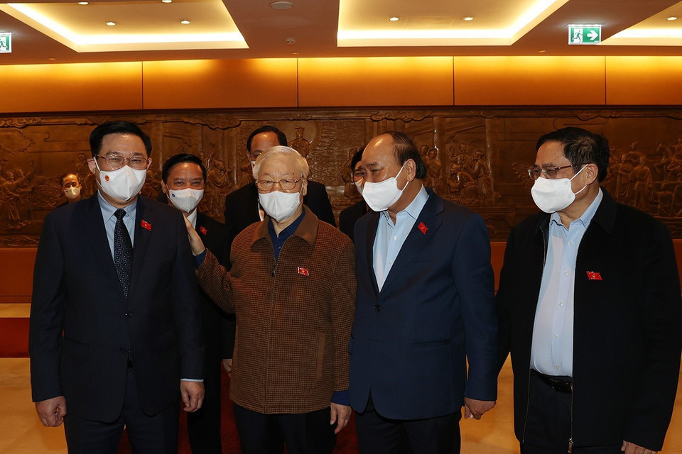 Tổng Bí thư Nguyễn Phú Trọng, Chủ tịch nước Nguyễn Xuân Phúc,Thủ tướng Chính phủ Phạm Minh Chính, Chủ tịch Quốc hội Vương Đình Huệ dự Kỳ họp thứ hai, Quốc hội khóa XV. (Ảnh: Trí Dũng/TTXVN)