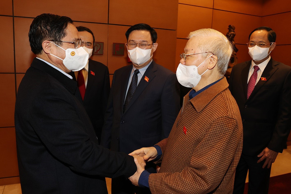 Tổng Bí thư Nguyễn Phú Trọng, Thủ tướng Chính phủ Phạm Minh Chính, Chủ tịch Quốc hội Vương Đình Huệ cùng các lãnh đạo Đảng, Nhà nước dự Kỳ họp thứ hai, Quốc hội khóa XV. (Ảnh: Trí Dũng/TTXVN)