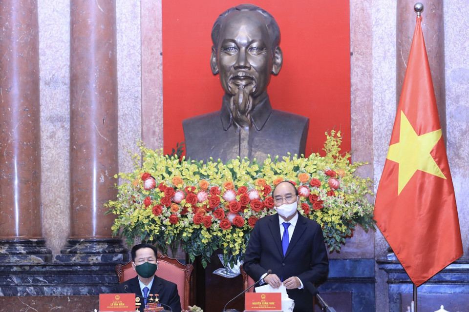 Chủ tịch nước Nguyễn Xuân Phúc phát biểu tại buổi gặp mặt đoàn đại biểu doanh nhân là cựu chiến binh. (Ảnh: Lâm Khánh/TTXVN)