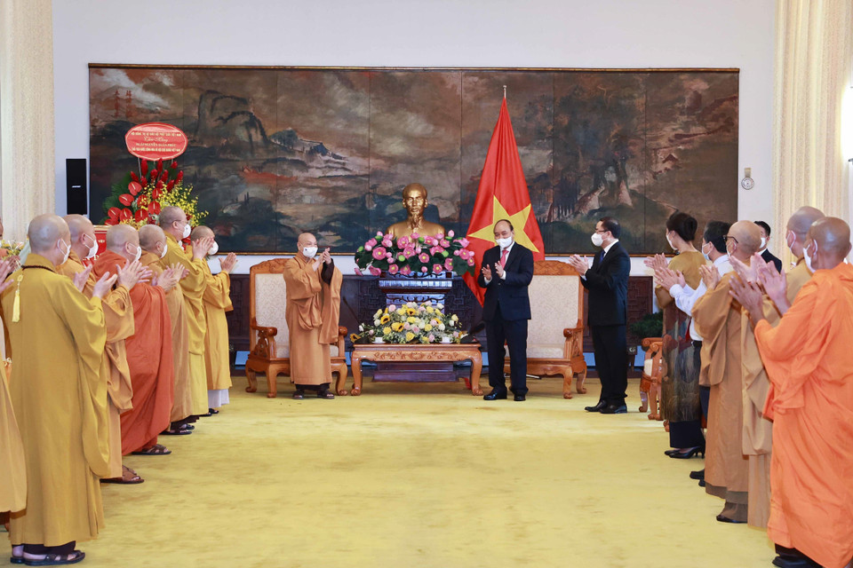 Chủ tịch nước Nguyễn Xuân Phúc với các đại biểu tại buổi tiếp. (Ảnh: Thống Nhất/TTXVN)