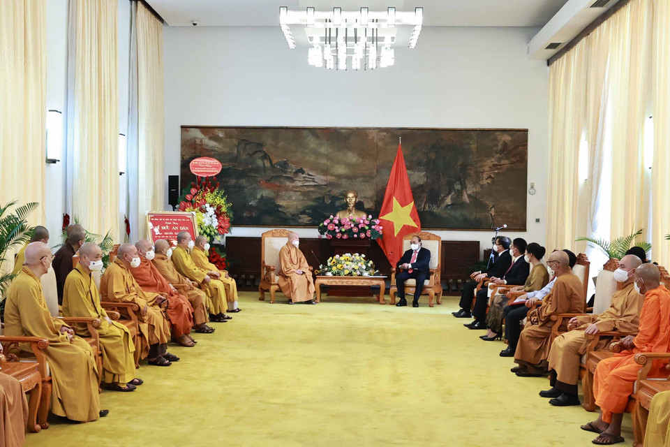 Chủ tịch nước Nguyễn Xuân Phúc với các đại biểu tại buổi tiếp. (Ảnh: Thống Nhất/TTXVN)