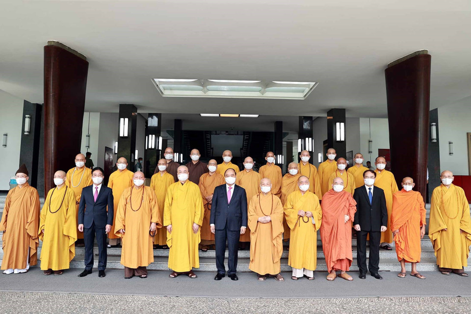 Chủ tịch nước Nguyễn Xuân Phúc với các đại biểu tại buổi tiếp. (Ảnh: Thống Nhất/TTXVN)