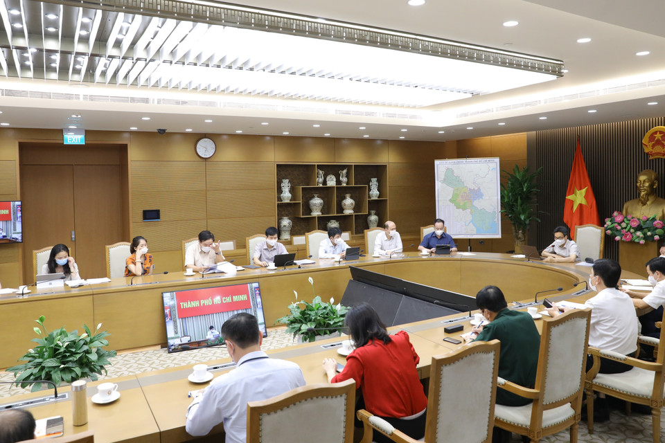 Quang cảnh cuộc họp giữa Phó Thủ tướng Chính phủ Vũ Đức Đam, Trưởng ban Chỉ đạo Quốc gia phòng, chống dịch COVID-19 với lãnh đạo Thành phố Hồ Chí Minh. (Ảnh: Nguyễn Điệp/TTXVN)