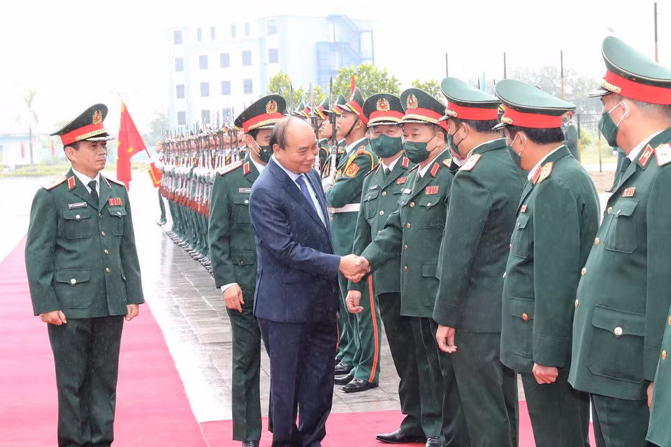 Chủ tịch nước Nguyễn Xuân Phúc, Chủ tịch Hội đồng Quốc phòng và An ninh, Thống lĩnh các lực lượng vũ trang dự buổi lễ. (Ảnh: Trọng Đức/TTXVN)