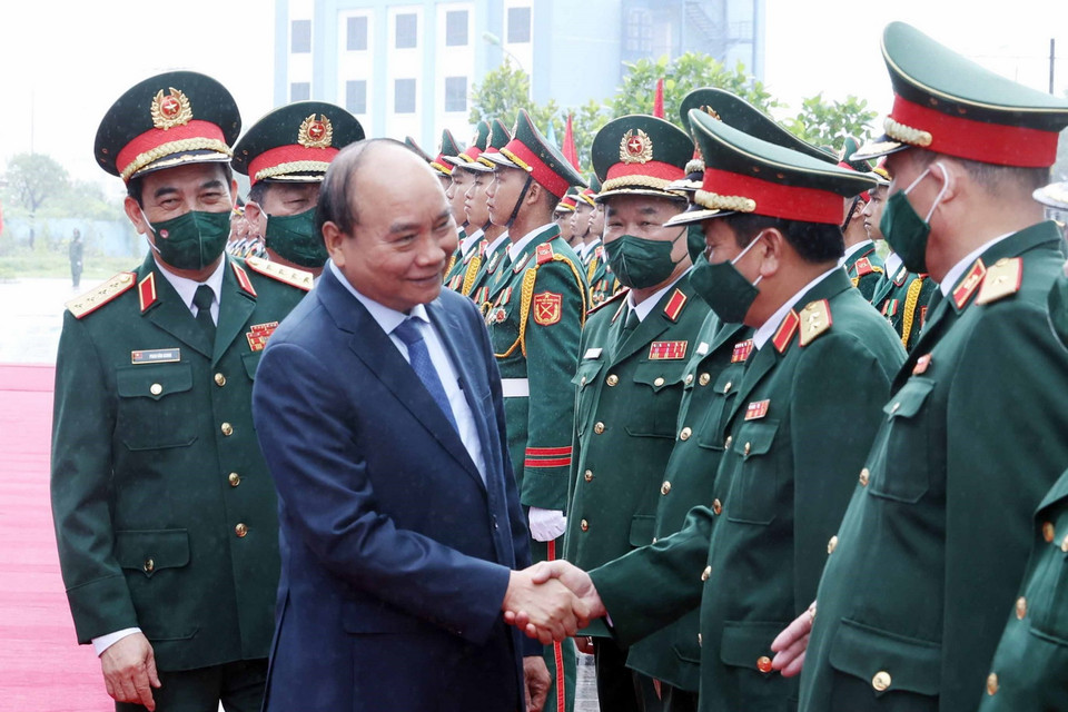 Chủ tịch nước Nguyễn Xuân Phúc với các đại biểu tham dự buổi lễ. (Ảnh: Thống Nhất/TTXVN)