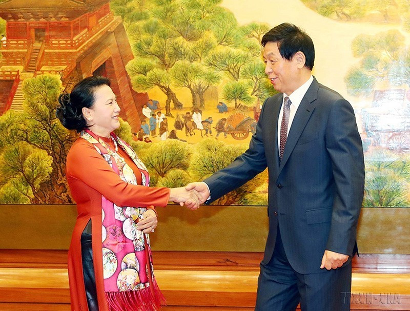 Chủ tịch Nhân đại Trung Quốc Lật Chiến Thư đón và hội đàm với Chủ tịch Quốc hội Nguyễn Thị Kim Ngân thăm chính thức Trung Quốc (11/7/2019). (Ảnh: Trọng Đức/TTXVN)