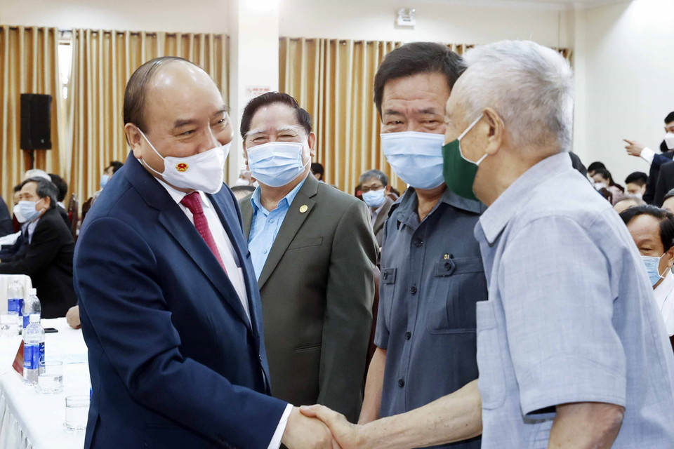 Chủ tịch nước Nguyễn Xuân Phúc và các đại biểu tại buổi gặp mặt. (Ảnh: Thống Nhất/TTXVN)