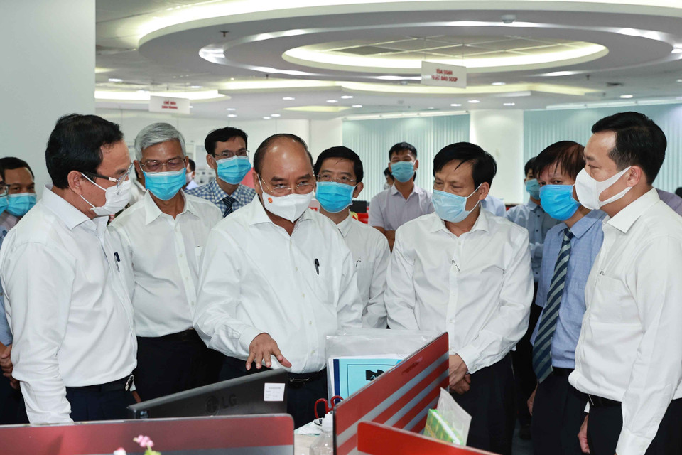 Chủ tịch nước Nguyễn Xuân Phúc thăm Báo Sài Gòn Giải phóng. (Ảnh: Thống Nhất/TTXVN)