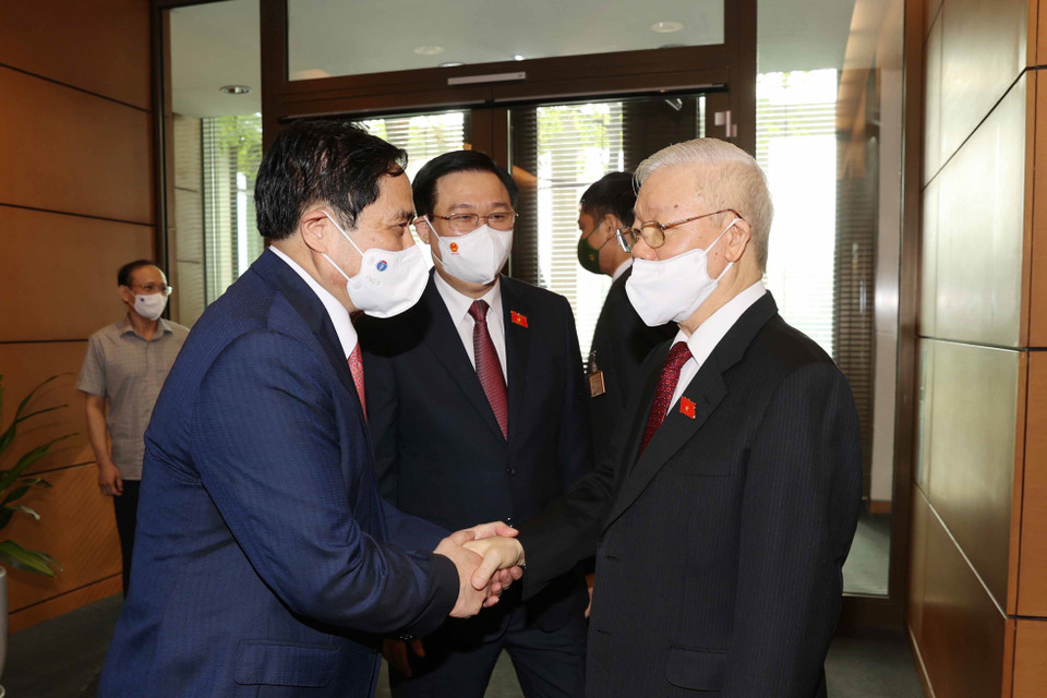 Tổng Bí thư Nguyễn Phú Trọng với Thủ tướng Phạm Minh Chính, Chủ tịch Quốc hội Vương Đình Huệ tại Lễ khai mạc.(Ảnh: Trí Dũng/TTXVN)