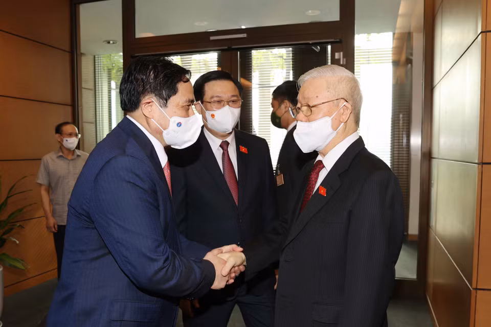 Tổng Bí thư Nguyễn Phú Trọng với Thủ tướng Phạm Minh Chính, Chủ tịch Quốc hội Vương Đình Huệ tại Lễ khai mạc.(Ảnh: Trí Dũng/TTXVN)