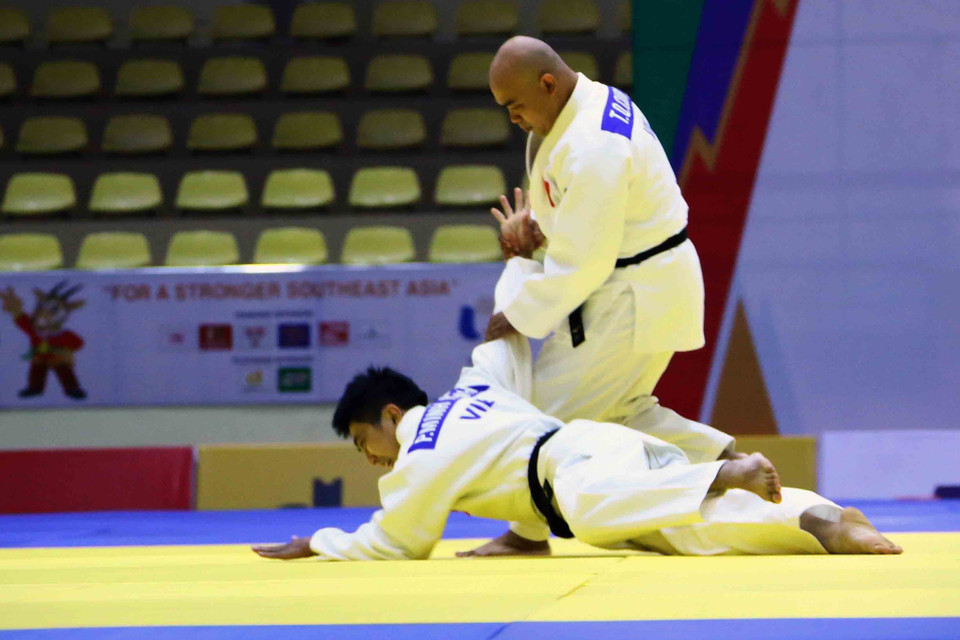 Hình ảnh cặp vận động viên Trần Quốc Cường-Phan Minh Hạnh (Việt Nam) thi đấu ở nội dung Kodokan Goshin Jutsu (bài quyền về các kỹ thuật tự vệ hiện đại) đối với nam và đạt 534.5 điểm để tiến vào vòng chung kết. (Ảnh: Quang Quyết/TTXVN) 