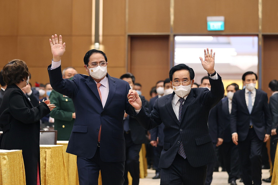 Hình ảnh Thủ tướng Phạm Minh Chính và Thủ tướng Lào Phankham Viphavanh đến dự buổi gặp gỡ. (Ảnh: Dương Giang/TTXVN)