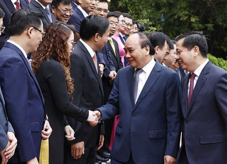 Chủ tịch nước Nguyễn Xuân Phúc với các đại biểu. (Ảnh: Thống Nhất/TTXVN)