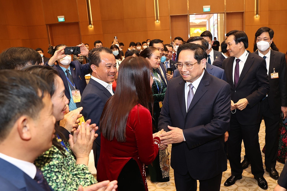 Thủ tướng Phạm Minh Chính gặp mặt kiều bào dự Xuân quê hương năm 2022. (Ảnh: Dương Giang/TTXVN)