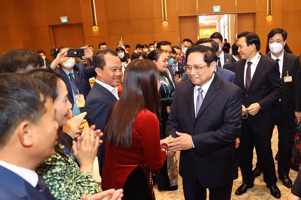 Thủ tướng Phạm Minh Chính gặp mặt kiều bào dự Xuân quê hương năm 2022. (Ảnh: Dương Giang/TTXVN)