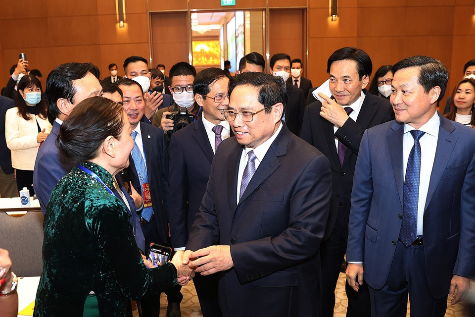 Hình ảnh Thủ tướng Phạm Minh Chính với các đại biểu kiều bào dự Xuân quê hương năm 2022. (Ảnh: Dương Giang/TTXVN)