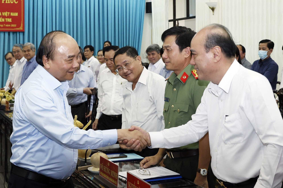 Chủ tịch nước Nguyễn Xuân Phúc với các đại biểu dự buổi làm việc. (Ảnh: Thống Nhất/TTXVN)