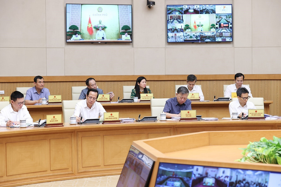 Thành viên Chính phủ và đại diện các cơ quan thuộc Chính phủ tham dự hội nghị. (Ảnh: Dương Giang/TTXVN)