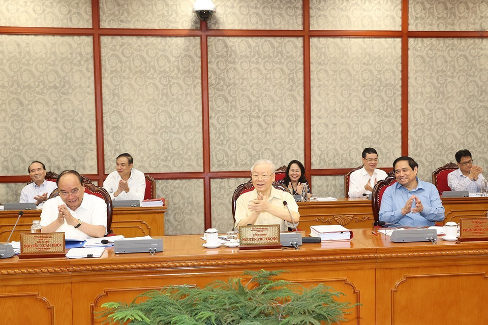 Tổng Bí thư Nguyễn Phú Trọng, Chủ tịch nước Nguyễn Xuân Phúc và Thủ tướng Phạm Minh Chính tại cuộc họp. (Ảnh: Trí Dũng/TTXVN)