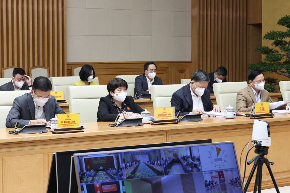 Các thành viên Ban Chỉ đạo Quốc gia phòng, chống dịch COVID-19 tham dự họp tại điểm cầu Chính phủ. (Ảnh: Dương Giang/TTXVN)